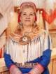 Marie Louise S. Heatta / Sametinget en person som bærer et samisk plagg (Bildebeskrivelsen er laget av en KI-tjeneste)