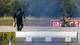 Foto: Axel Schmidt / REUTERS,NTB A police officer in protective clothing walks next to an explosive-disarming robot (EOD) at Leipzig/Halle Airport