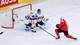 Denis Balibouse / REUTERS,NTB Ishockeyspillere i hvite og røde drakter spiller foran et mål. En spiller i rød drakt er i kneledd. En annen spiller i hvit drakt med nummer 49 er bak et mål. En tredje spiller med nummer 40 i hvit drakt står foran målet. (Bildebeskrivelsen er laget av en KI-tjeneste)