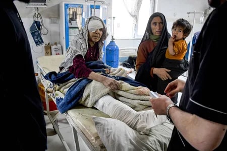 A woman receives treatment in a hospital after the earthquake in Mazar-e-Sharif