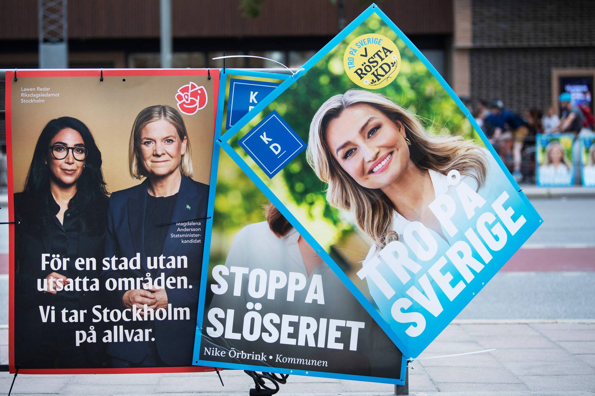 Election posters of Ebba Busch (R), leader of Sweden's Christian Democrats, and of candidates from the Social Democrats Lawen Redar (L) and Magdalena Andersson are pictured in Stockholm, Sweden, on August 18, 2026. General elections will be held in Sweden on September 13, 2026. (Photo by Viktoria BANK / TT News Agency / AFP) / Sweden OUT