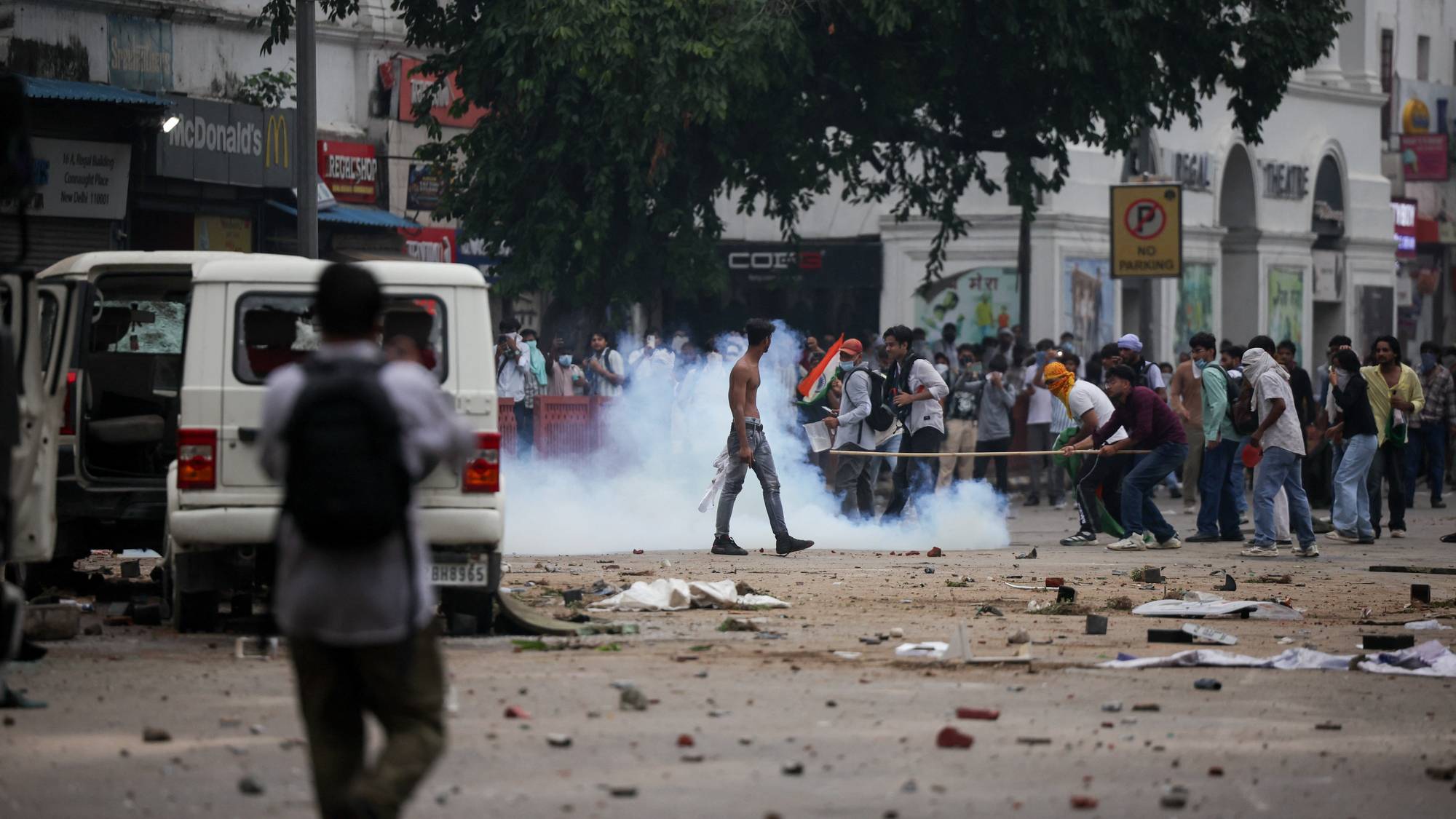 Tear gas spreads around protesters as supporters of India's Cockroach Janta Party demonstrate on the opening day of the Indian parliament's monsoon session, demanding the resignation of Education Minister Dharmendra Pradhan over exam paper leaks, in New Delhi, India, July 20, 2026. REUTERS/Anushree Fadnavis