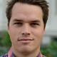Universitetet i Oslo Bilde av Stian Øby Johansen. Han står ute og ser rett inn i kameraet.