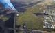 ICELANDIC DEPARTMENT OF CIVIL PR / AFP / NTB Luftfoto av et vulkanutbrudd rett ved bebyggelse