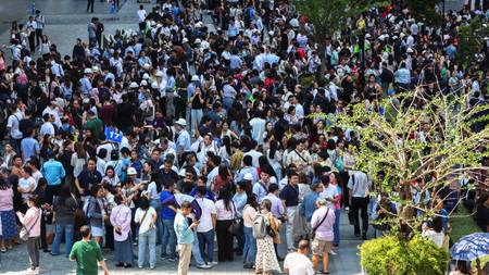 People in Bangkok, Thailand evacuated after the quake. A crowd gathered outside