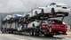 AP FILE - In this May 12, 2020 file photo, a truck loaded with Tesla cars departs the Tesla plant in Fremont, Calif. Tesla has posted three straight profitable quarters, opened a factory in China and rolled out the Model Y small SUV. Yet ahead of second-quarter results on Wednesday, July 21, analysts are beginning to question whether the run will last. (AP Photo/Ben Margot, File)